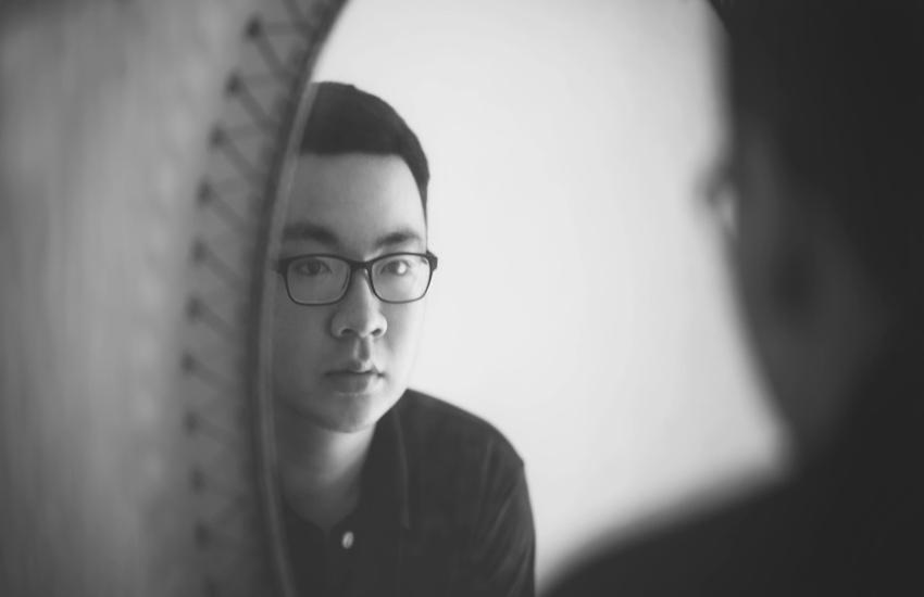man looking in a mirror