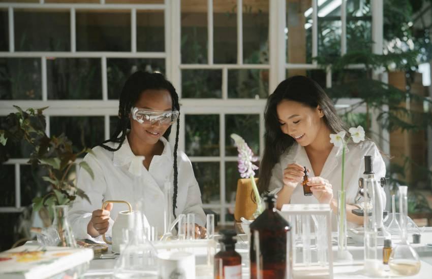 scientists working with test tubes and flowers
