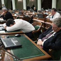 people asleep at their desks in congress